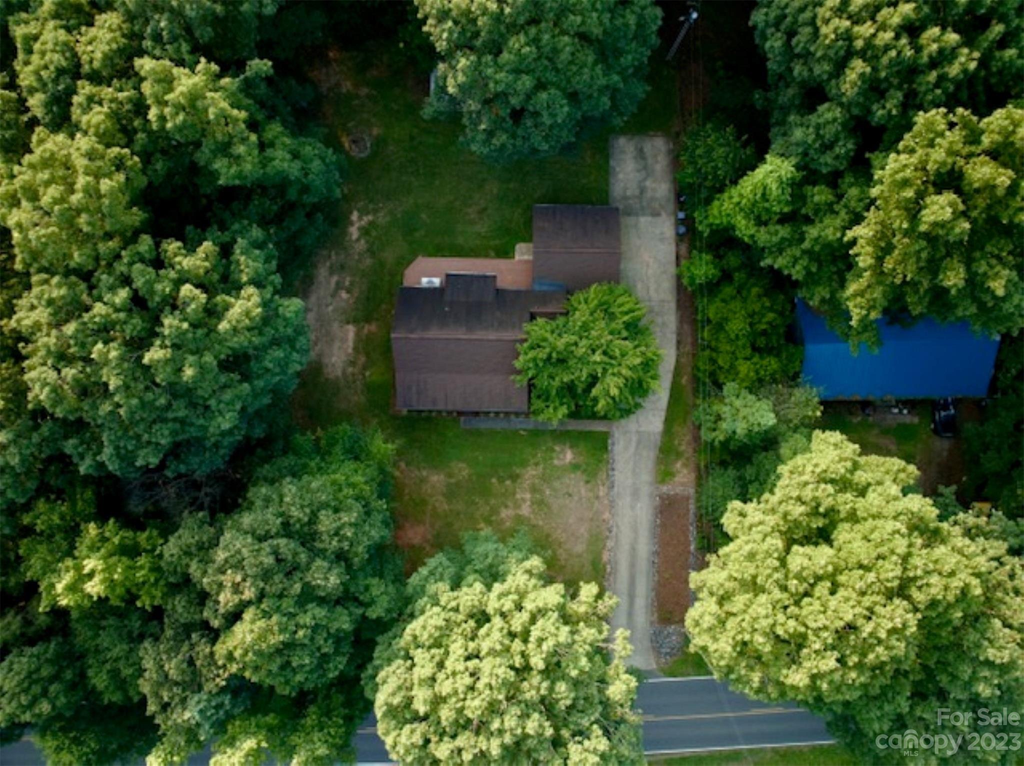 2743 Harmony Highway Harmony, NC 28634 - Photo 3 of 47 an aerial view of a house with a yard basket ball court and outdoor seating