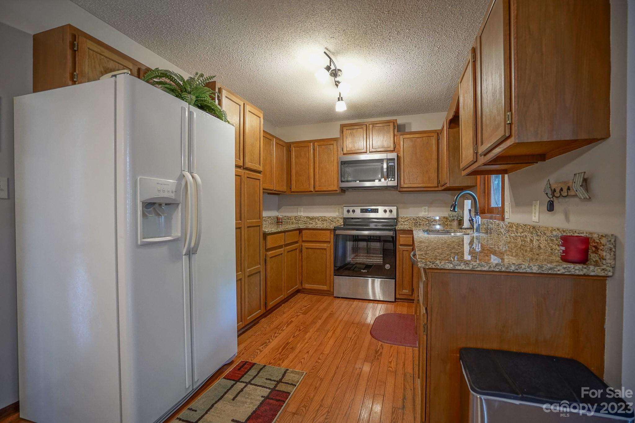 2743 Harmony Highway Harmony, NC 28634 - Photo 31 of 47 a kitchen with stainless steel appliances granite countertop a refrigerator stove and sink