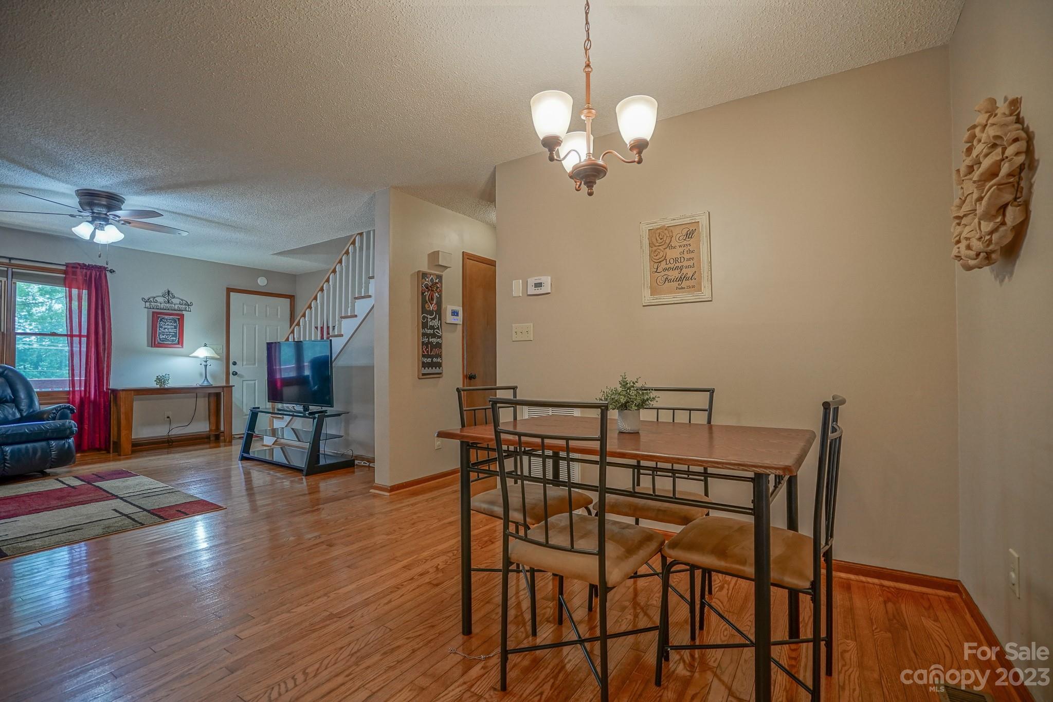 2743 Harmony Highway Harmony, NC 28634 - Photo 35 of 47 a view of a dining room with furniture and wooden floor
