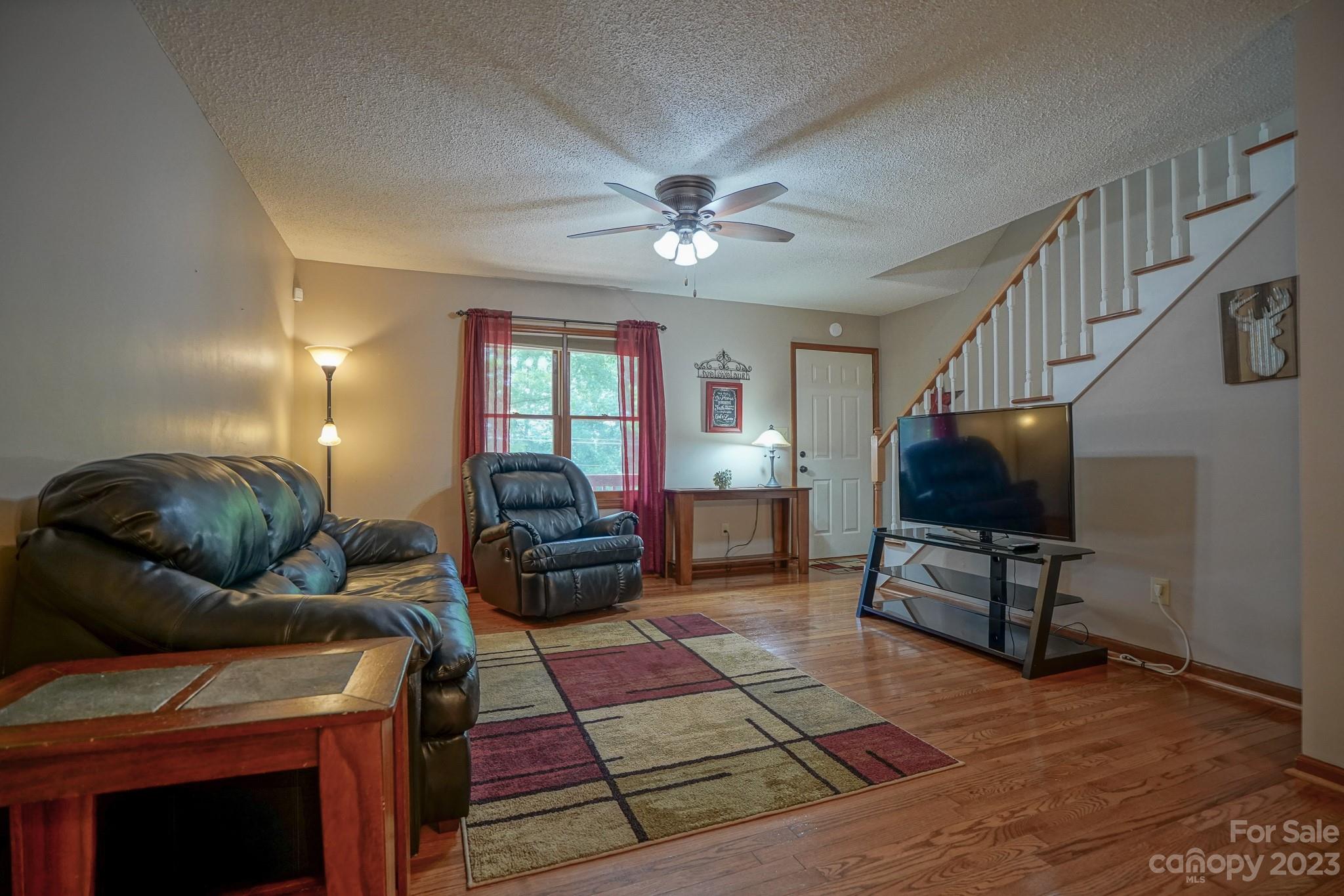 2743 Harmony Highway Harmony, NC 28634 - Photo 36 of 47 a living room with furniture and a flat screen tv