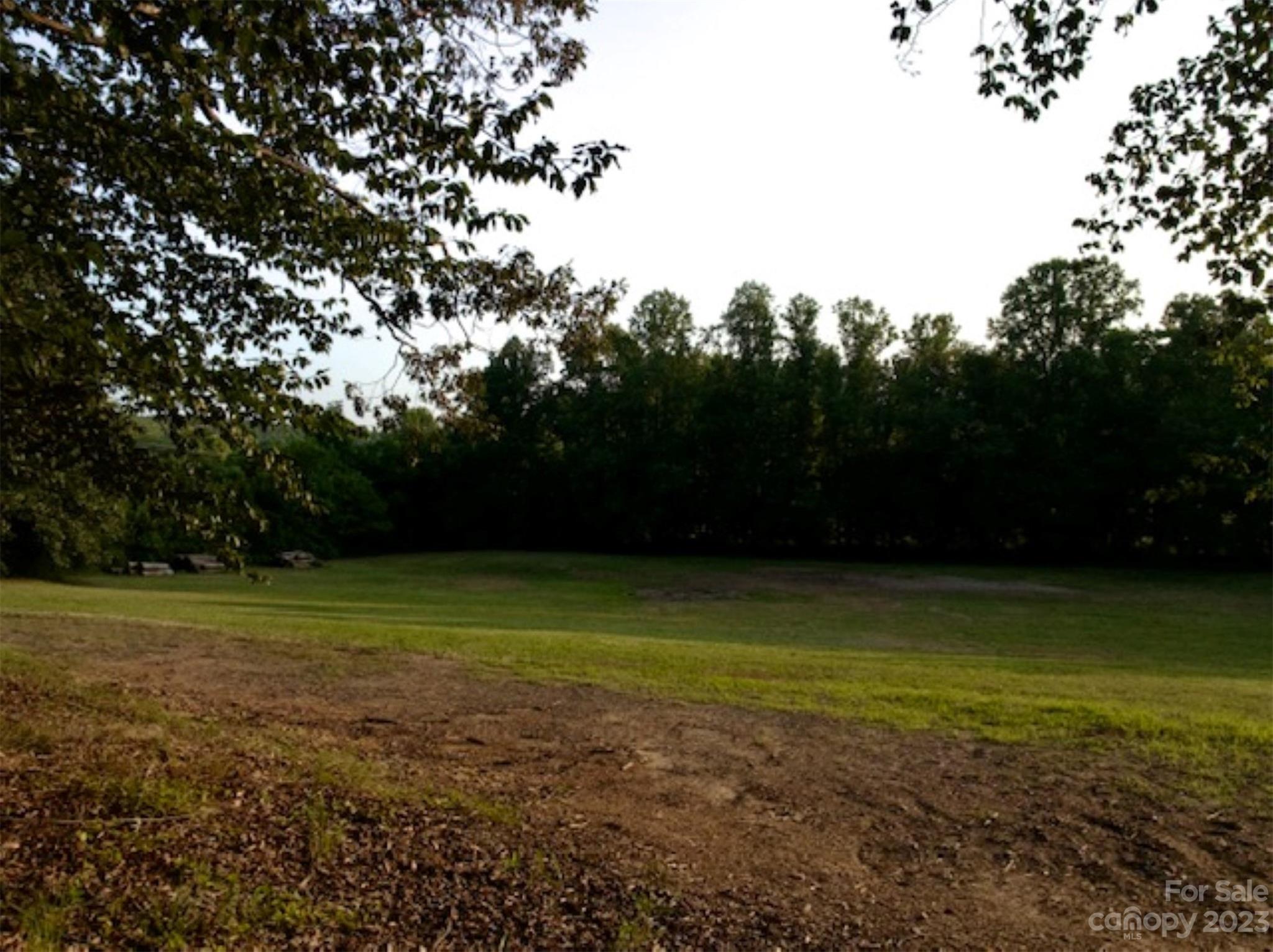 2743 Harmony Highway Harmony, NC 28634 - Photo 44 of 47 a view of a field with trees in the background