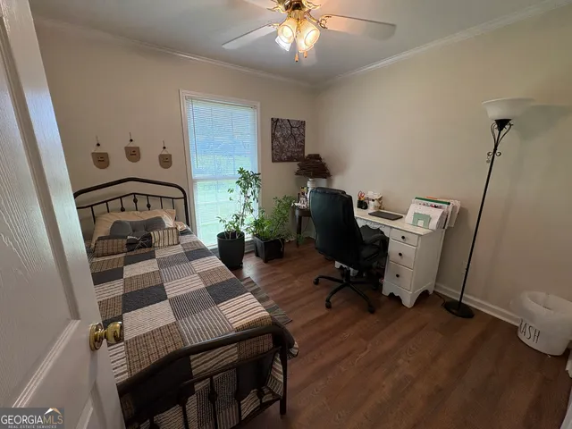 a bedroom with a bed and a chair