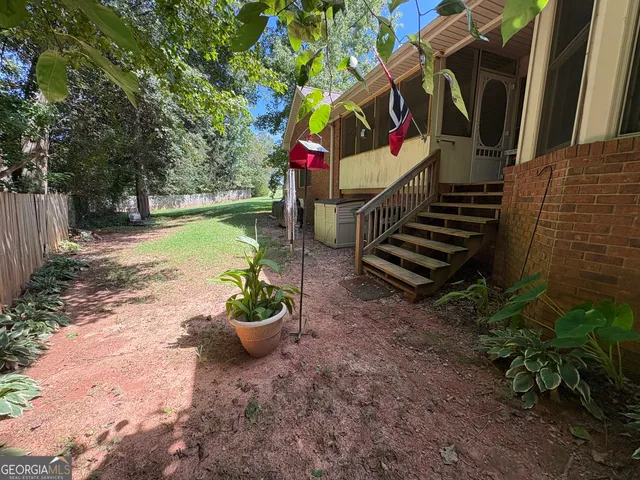 a view of a backyard with a garden