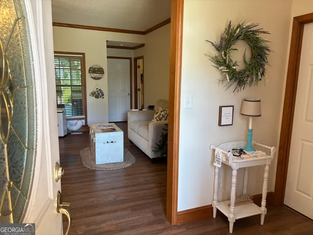 a view of living room with furniture and wooden floor