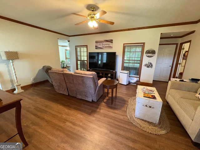 a living room with furniture and a flat screen tv