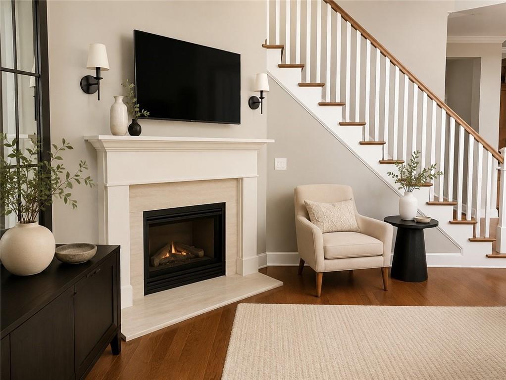 104 Willow Overlook Canton, GA 30115 - Photo 2 of 27 a living room with furniture a flat screen tv and a fireplace