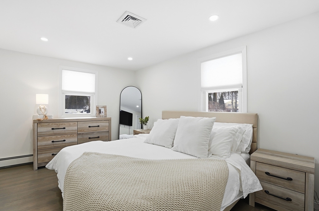 82 Water Street Saugus, MA 01906 - Photo 12 of 40 a bedroom with a large bed and a window