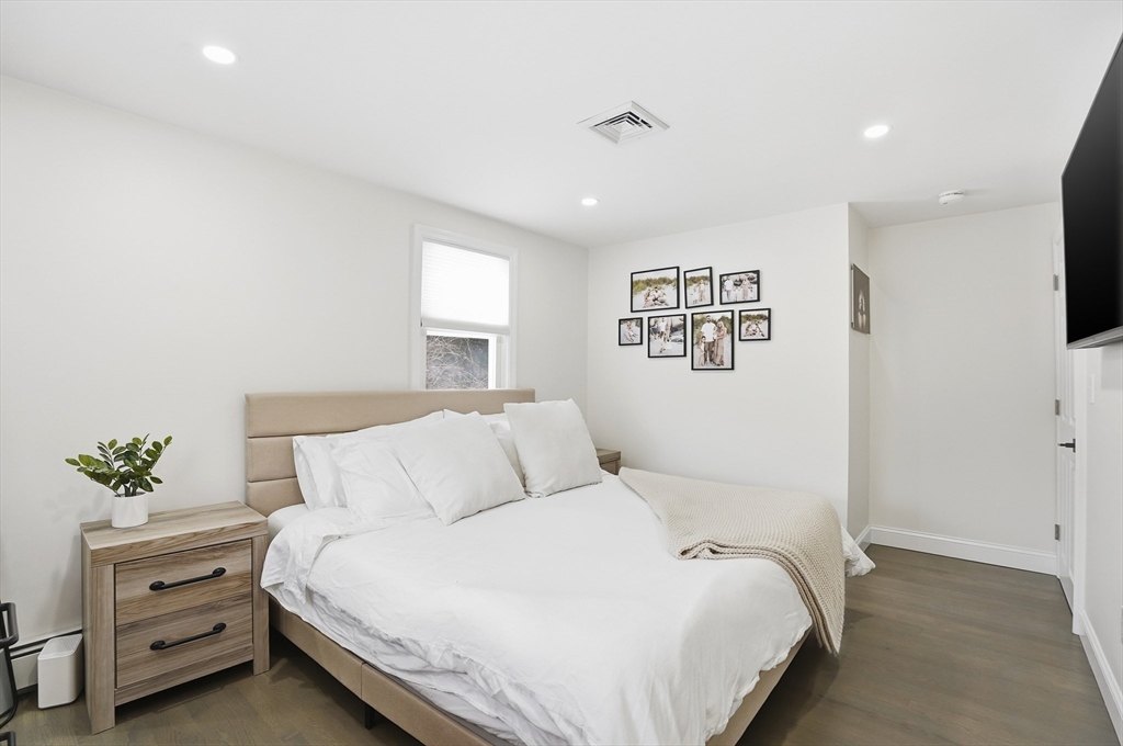 82 Water Street Saugus, MA 01906 - Photo 13 of 40 a bedroom with a bed and a window