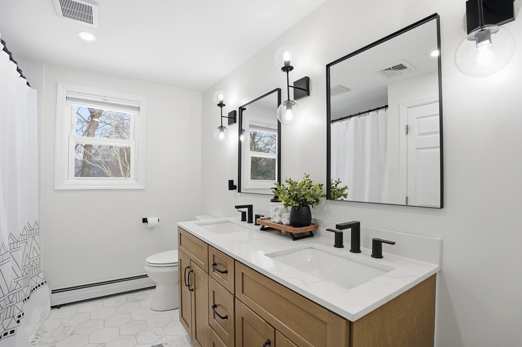 82 Water Street Saugus, MA 01906 - Photo 15 of 40 a bathroom with a sink and a mirror