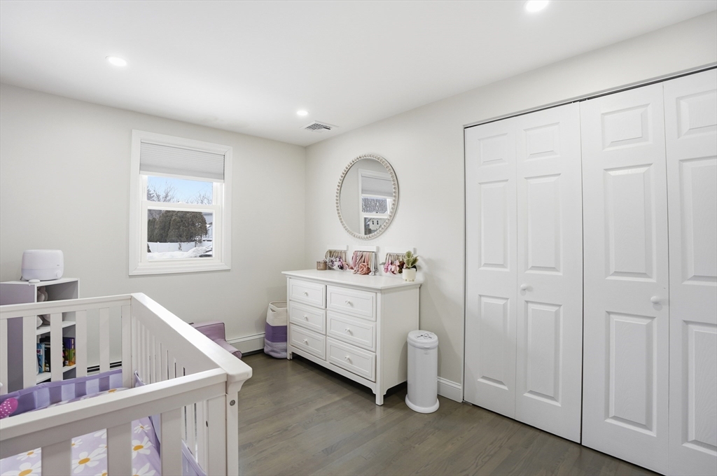 82 Water Street Saugus, MA 01906 - Photo 19 of 40 a view of room with baby crib and bedroom
