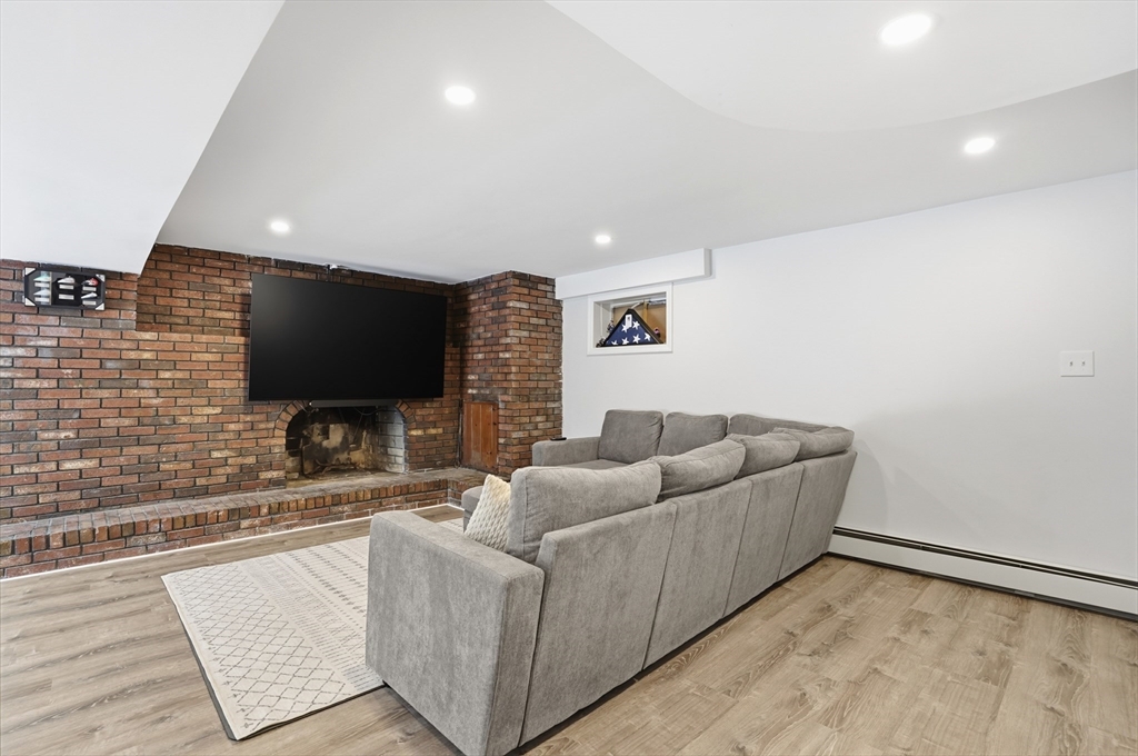 82 Water Street Saugus, MA 01906 - Photo 22 of 40 a living room with furniture and a flat screen tv
