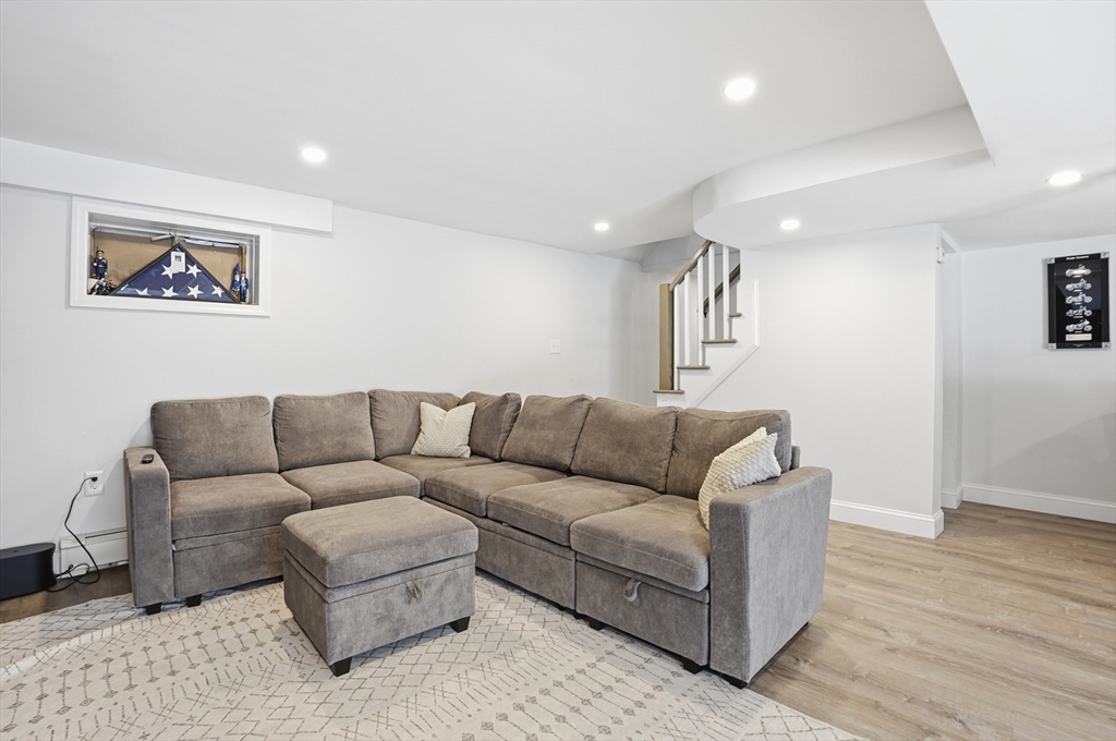 82 Water Street Saugus, MA 01906 - Photo 23 of 40 a living room with furniture and a wooden floor