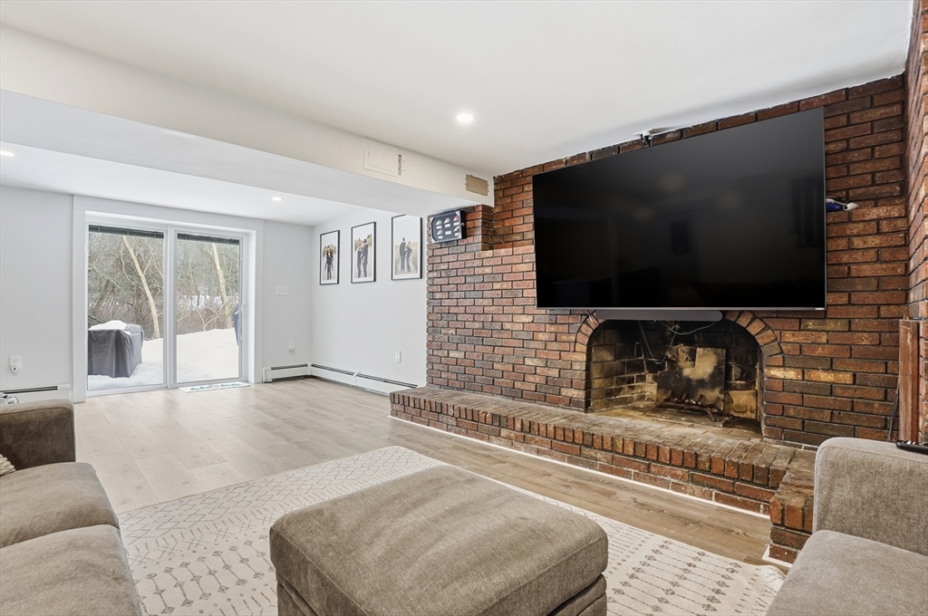 82 Water Street Saugus, MA 01906 - Photo 24 of 40 a living room with furniture and a flat screen tv