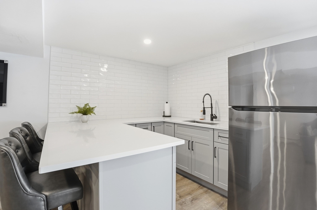 82 Water Street Saugus, MA 01906 - Photo 26 of 40 a kitchen with a table and chairs