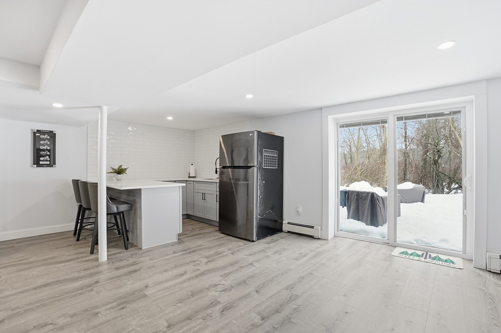 82 Water Street Saugus, MA 01906 - Photo 27 of 40 a view of kitchen with stainless steel appliances refrigerator oven dining table and chairs