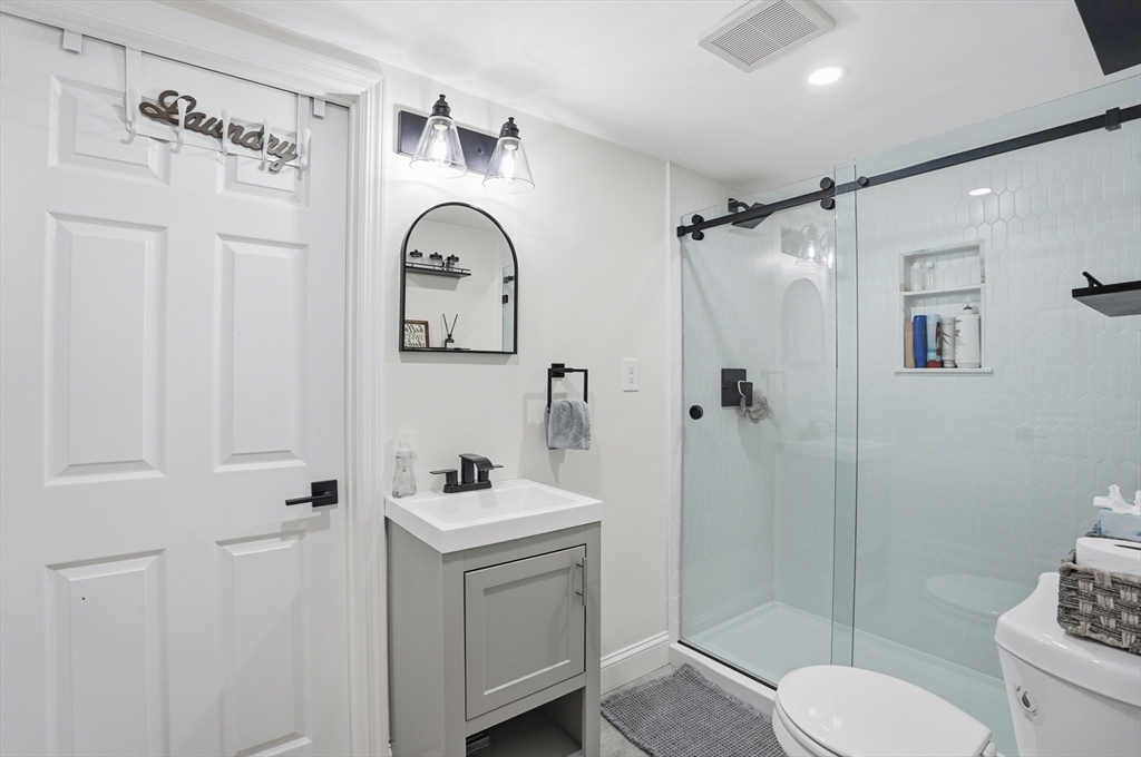 82 Water Street Saugus, MA 01906 - Photo 30 of 40 a bathroom with a toilet sink and shower