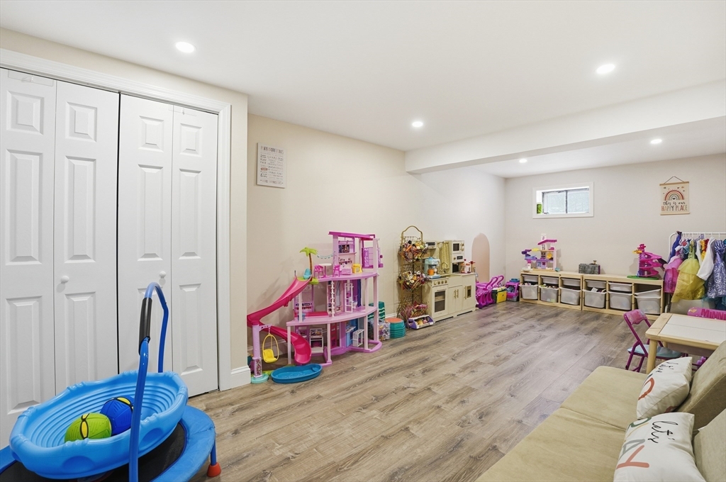 82 Water Street Saugus, MA 01906 - Photo 31 of 40 a living room with furniture and a wooden floor