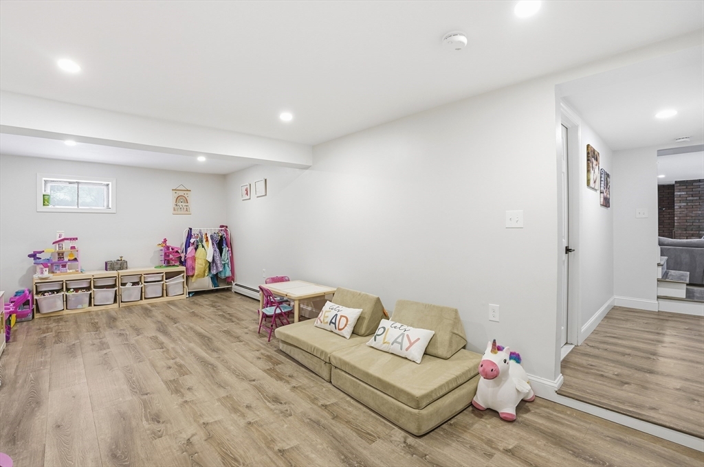 82 Water Street Saugus, MA 01906 - Photo 32 of 40 a living room with furniture and a wooden floor