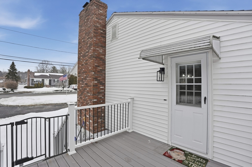 82 Water Street Saugus, MA 01906 - Photo 35 of 40 a view of a balcony with chair and wooden floor