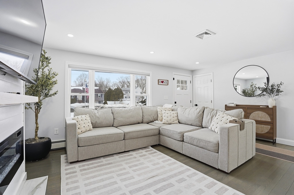 82 Water Street Saugus, MA 01906 - Photo 8 of 40 a living room with furniture and a large window