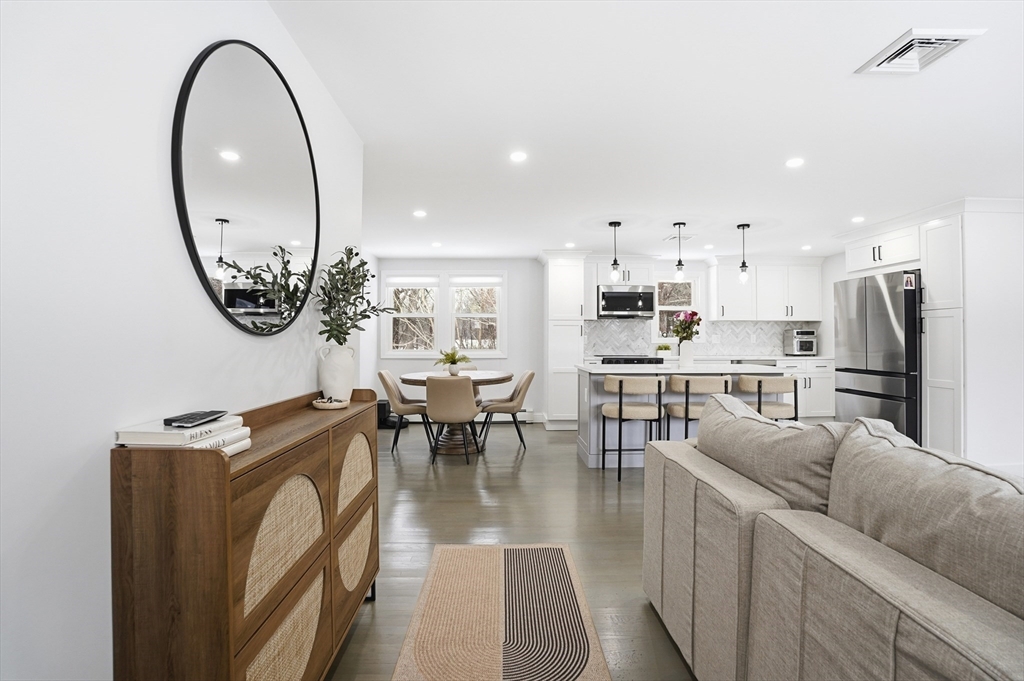82 Water Street Saugus, MA 01906 - Photo 9 of 40 a living room with furniture a table and kitchen view