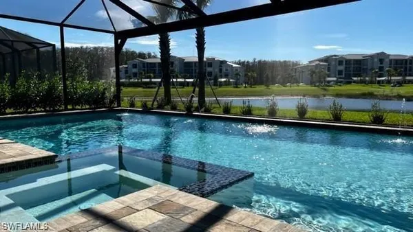 a roof deck with table and chairs and potted plants