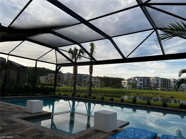 a living room with furniture a window and a table