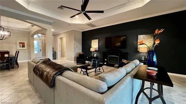 a view of a dining room with furniture wooden floor and a chandelier
