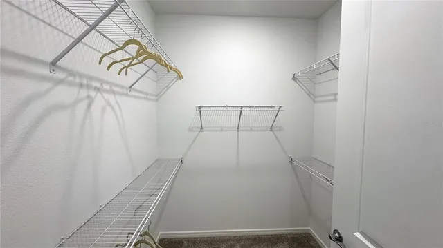 a view of a bathroom from a hallway