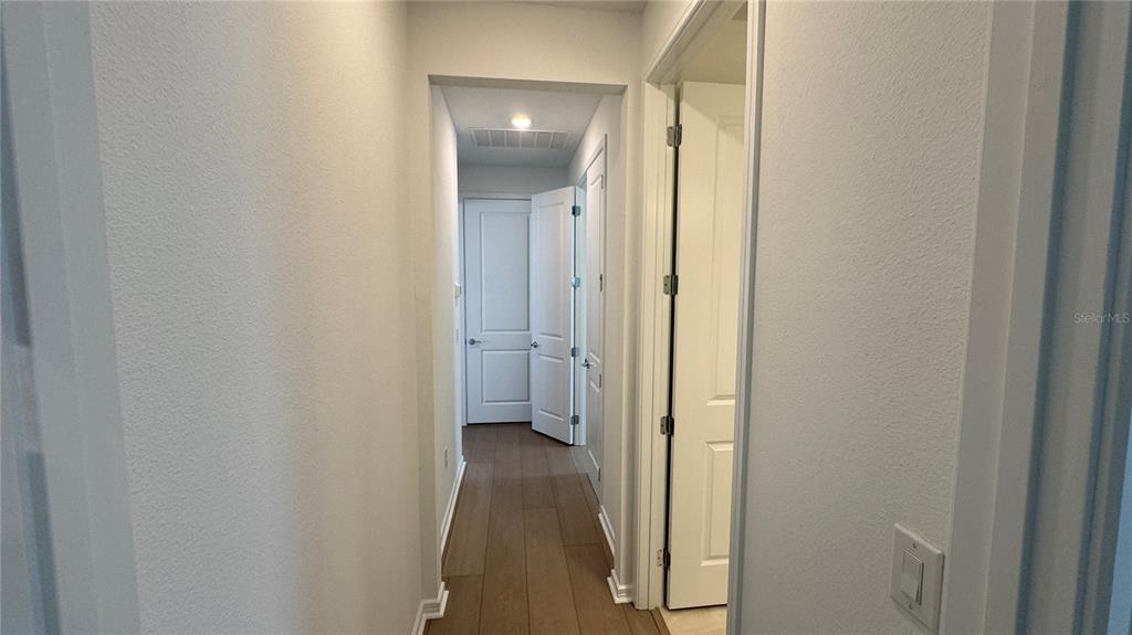 9408 Coastline Way Palmetto, FL 34221 - Photo 14 of 41 a view of a bathroom from a hallway