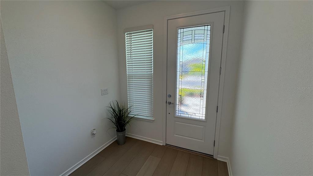 9408 Coastline Way Palmetto, FL 34221 - Photo 22 of 41 a view of an empty room with a window