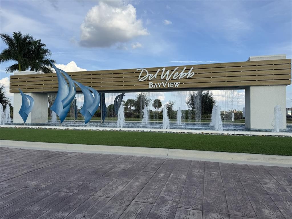 9408 Coastline Way Palmetto, FL 34221 - Photo 28 of 41 a front view of a house with a garden