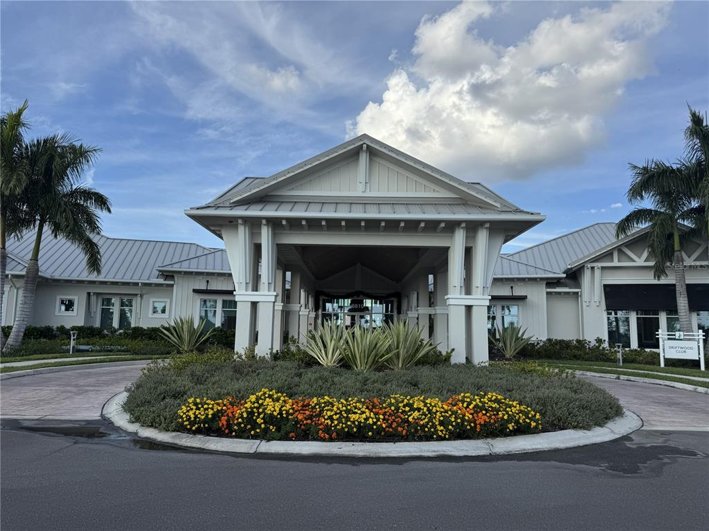 9408 Coastline Way Palmetto, FL 34221 - Photo 29 of 41 a front view of a house with a garden