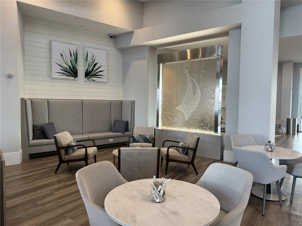 9408 Coastline Way Palmetto, FL 34221 - Photo 39 of 41 a dining room with furniture and wooden floor