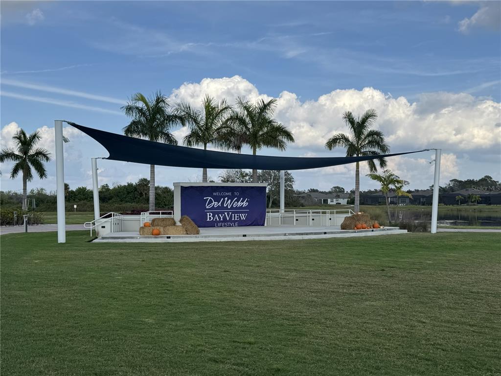 9408 Coastline Way Palmetto, FL 34221 - Photo 40 of 41 a view of a swimming pool with a yard