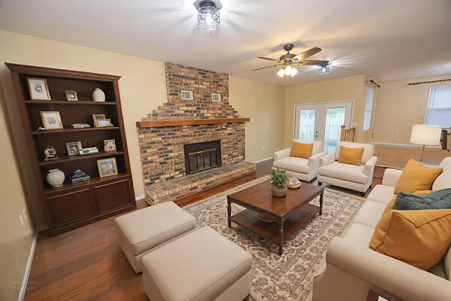 a living room with furniture and a fireplace