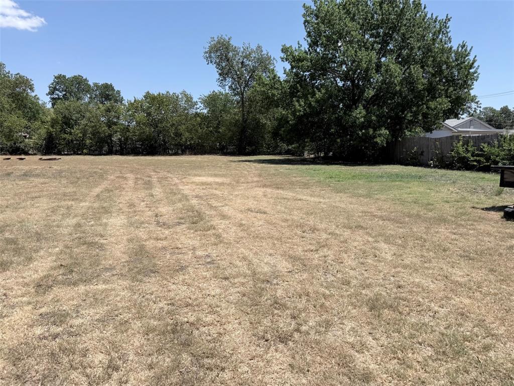 312 Ralph Street White Settlement, TX 76108 - Photo 12 of 32 Expansive lot with mature perimeter trees, offering ample green space