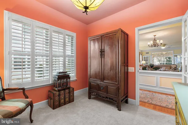 a view of a livingroom with furniture and a window
