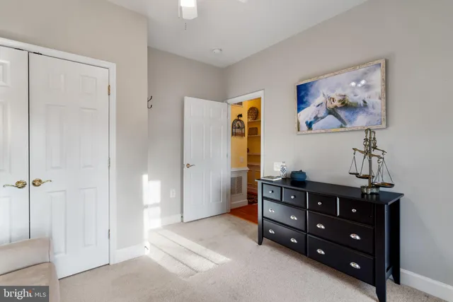 a room with a dresser and a mirror