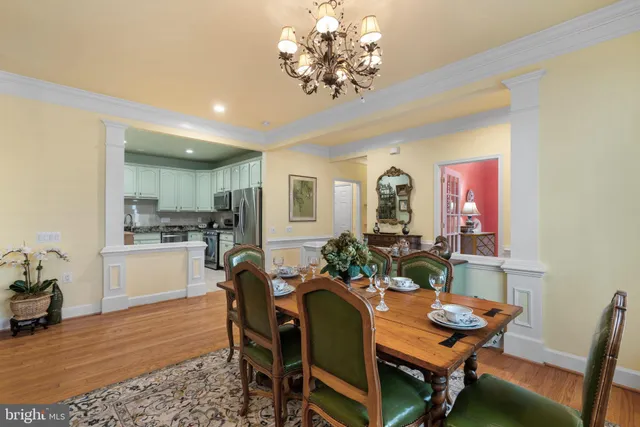 a view of a dining room with furniture and chandelier