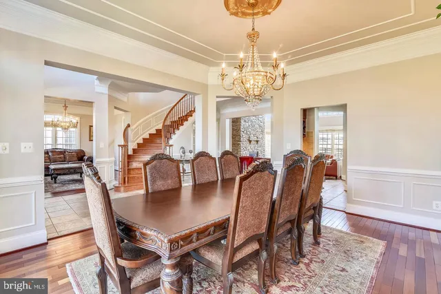 a living room with furniture a fireplace and a table