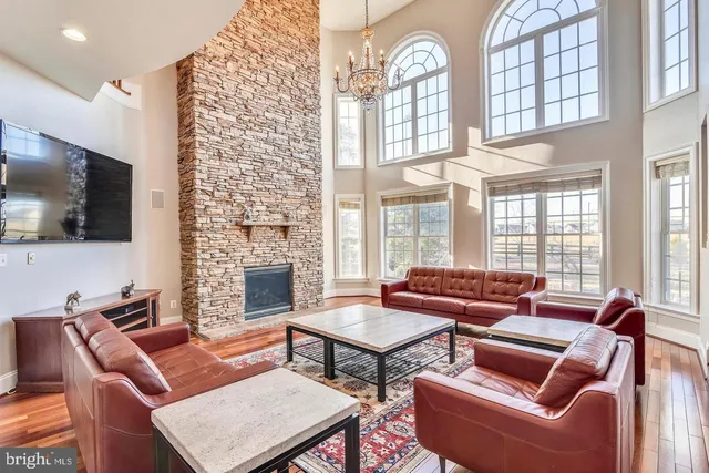a view of entryway bedroom and hall with wooden floor