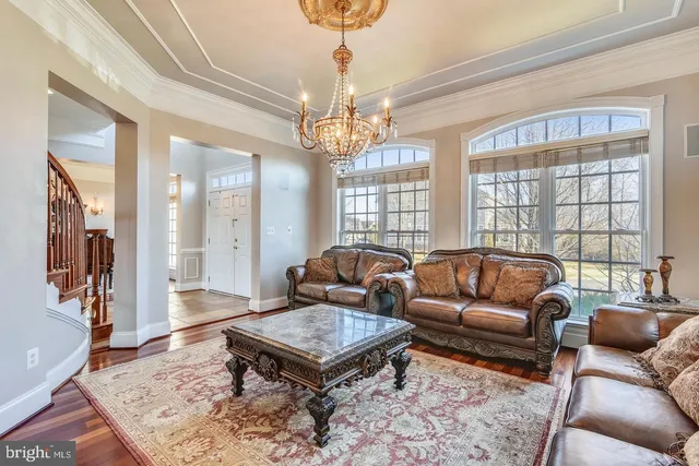 a view of staircase with wooden floor and window