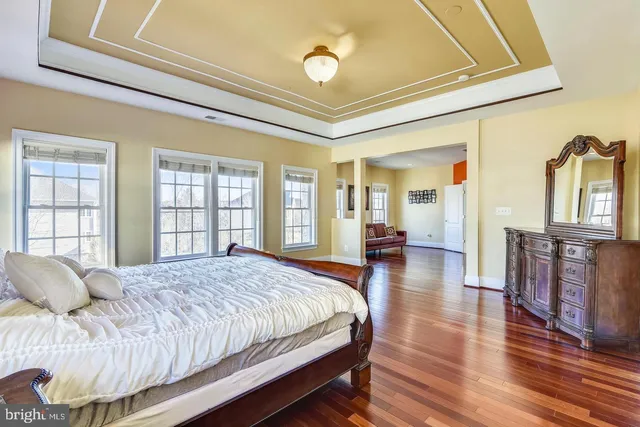 a living room with furniture a rug and a large window