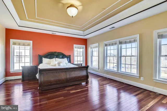 a room with pool table and windows