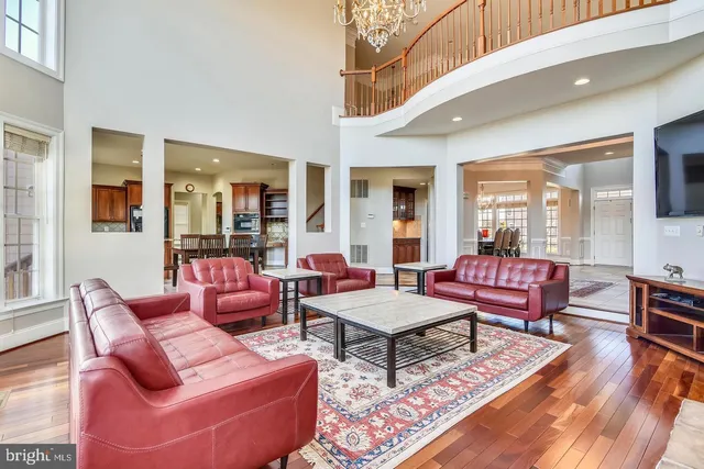 a view of a dining room with furniture large windows and wooden floor