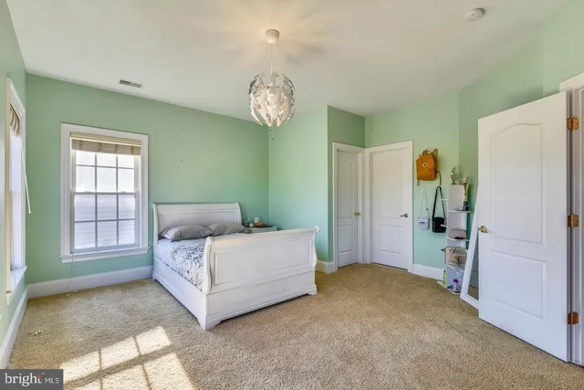 a view of a garden with a building in the background