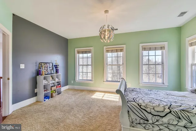 a view of a lake with houses in the back