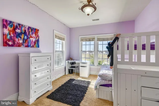 a view of a swimming pool with a table and chairs