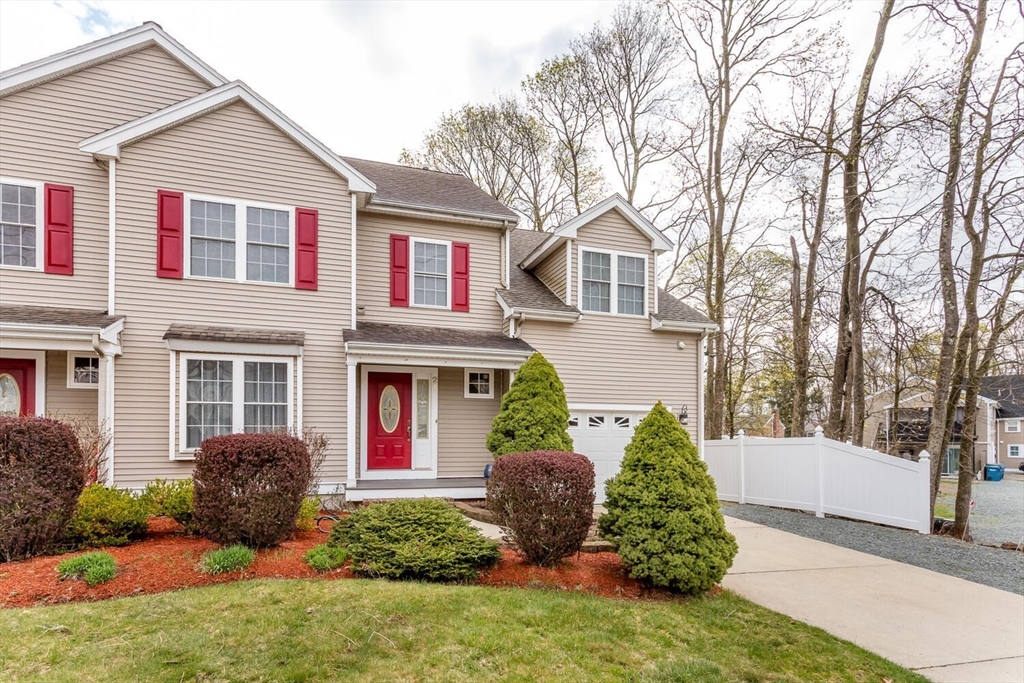 21 Hartwell Place, Unit 21 Canton, MA 02021 - Photo 1 of 33 front view of a house with a yard